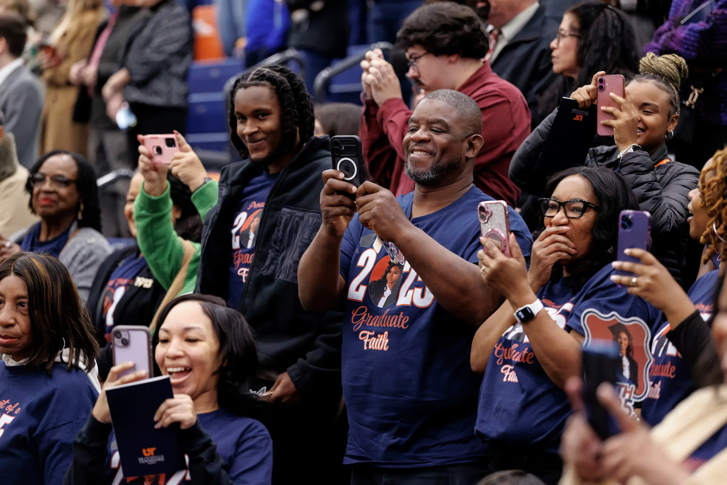 Families celebrate their Skyhawk at commencement.